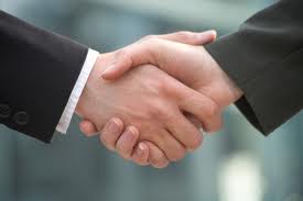 A hand shake, representing closing a deal in a bank